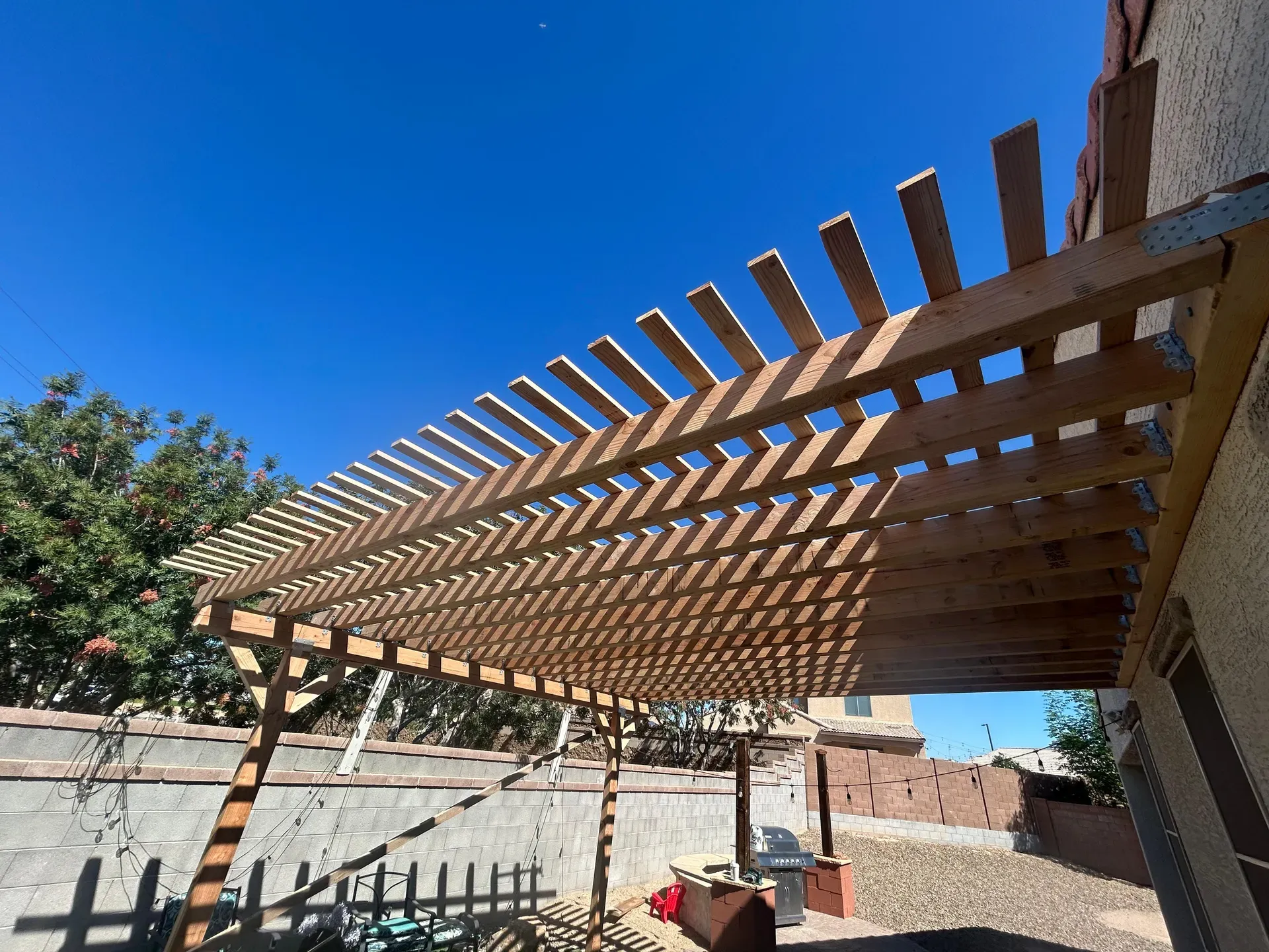 Pergola framing against a clear Arizona sky